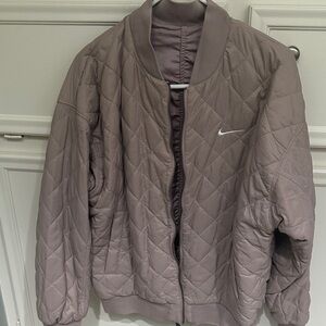 Nike Sportswear Women's Reversible Varsity Bomber Jacket in Diffused Taupe.